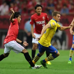 Arsenal's Aaron Ramsey Outruns Urawa Red Diamonds Shuto Kojima Arsenal's Aaron Ramsey Outruns Urawa Red Diamonds Shuto Kojima