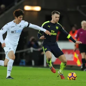 Arsenal's Aaron Ramsey Outwits Ki Sung-Yueng in Premier League Clash Arsenal's Aaron Ramsey Outwits Ki Sung-Yueng in Premier League Clash