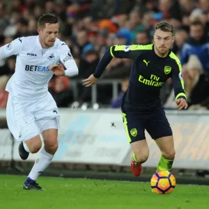 Arsenal's Aaron Ramsey Outwits Swansea's Sigurdsson: Intense Premier League Battle Arsenal's Aaron Ramsey Outwits Swansea's Sigurdsson: Intense Premier League Battle