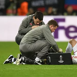 Arsenal's Aaron Ramsey Receives Medical Attention from Colin Lewin and Gary O'Driscoll during CSKA Moscow Match, UEFA Europa League 2018