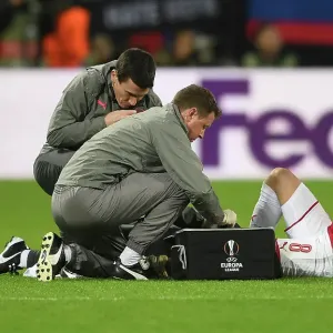 Arsenal's Aaron Ramsey Receives Medical Attention from Colin Lewin and Gary O'Driscoll during CSKA Moscow Match, UEFA Europa League 2018