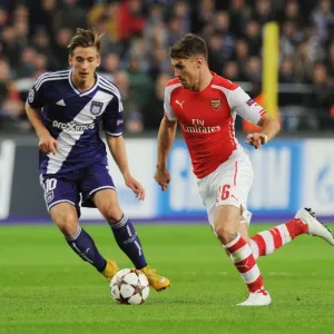 Arsenal's Aaron Ramsey Scores Past Anderlecht's Dennis Praet in 2014-15 Champions League Clash