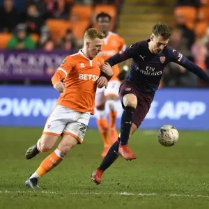 Arsenal's Aaron Ramsey Scores Past Blackpool's Callum Guy in FA Cup Third Round