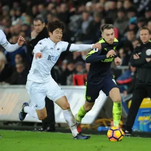 Arsenal's Aaron Ramsey Scores Past Swansea's Ki and Sigurdsson (January 2017) Arsenal's Aaron Ramsey Scores Past Swansea's Ki and Sigurdsson (January 2017)