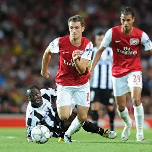 Arsenal's Aaron Ramsey Scores Past Udinese's Pablo Armero in 2011-12 UEFA Champions League Play-Off