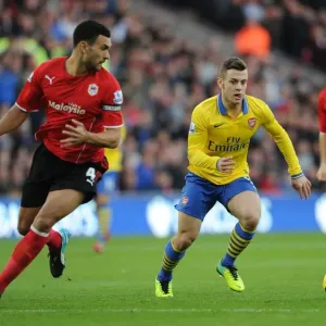 Arsenal's Aaron Ramsey Tangles with Steven Caulker in Premier League Clash (Cardiff City vs Arsenal, 2013)