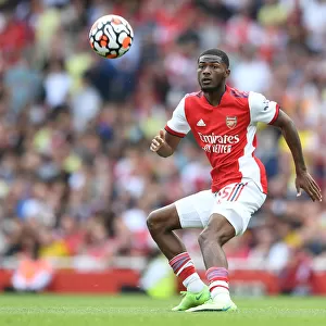 Arsenal's Ainsley Maitland-Niles in Action: Arsenal vs. Norwich City (2021-22) - Premier League Clash at Emirates Stadium