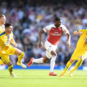 Arsenal's Ainsley Maitland-Niles Faces Off Against Crystal Palace's Joel Ward and Luka Milivojevic