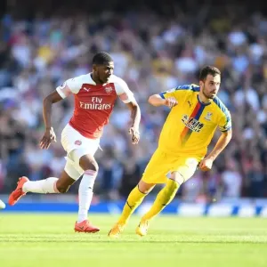 Arsenal's Ainsley Maitland-Niles Faces Off Against Crystal Palace's Joel Ward and Luka Milivojevic