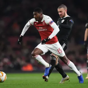 Arsenal's Ainsley Maitland-Niles Faces Off Against Qarabag's Maksin Medvedev in Europa League Clash