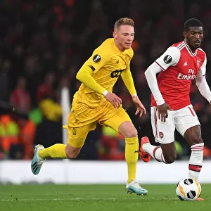 Arsenal's Ainsley Maitland-Niles Goes Head-to-Head with Renaud Emond in Europa League Showdown