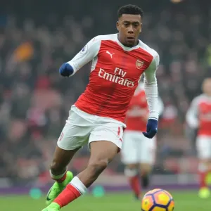Arsenal's Alex Iwobi in Action against Hull City during 2016-17 Premier League Clash at Emirates Stadium