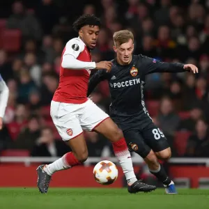 Arsenal's Alex Iwobi Clashes with CSKA Moscow's Konstantin Kuchaev in Europa League Quarterfinal