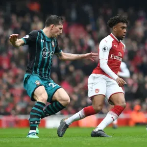 Arsenal's Alex Iwobi Clashes with Southampton's Pierre-Emile Hojbjerg in Intense Premier League Showdown