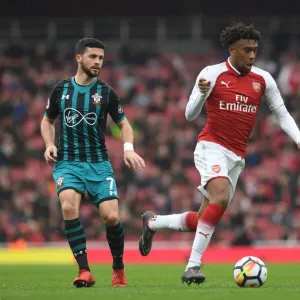 Arsenal's Alex Iwobi Clashes with Southampton's Shane Long in Premier League Showdown
