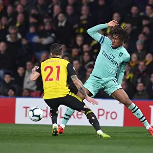 Arsenal's Alex Iwobi Clashes with Watford's Kiko Femenia in Premier League Showdown