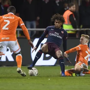 Arsenal's Alex Iwobi Faces Off Against Blackpool Defenders in FA Cup Clash