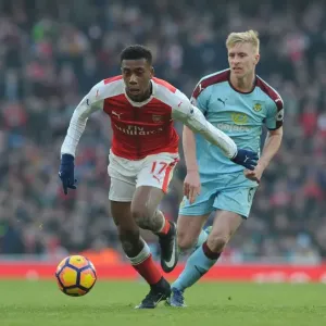 Arsenal's Alex Iwobi Faces Off Against Burnley's Ben Mee in Premier League Clash