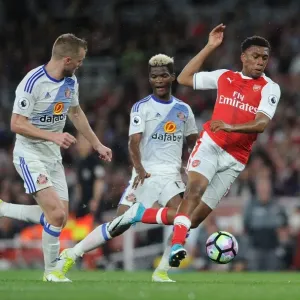 Arsenal's Alex Iwobi Fouled by Sunderland's Didier Ndong during Premier League Match Arsenal's Alex Iwobi Fouled by Sunderland's Didier Ndong during Premier League Match