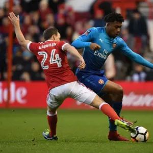 Arsenal's Alex Iwobi Outmaneuvers Nottingham Forest's David Vaughan in FA Cup Clash Arsenal's Alex Iwobi Outmaneuvers Nottingham Forest's David Vaughan in FA Cup Clash
