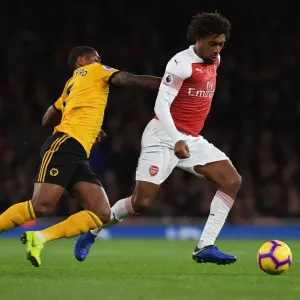 Arsenal's Alex Iwobi Outmaneuvers Wolverhampton's Ivan Cavaleiro