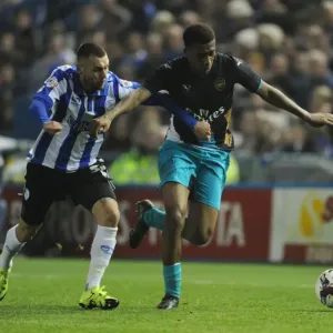 Arsenal's Alex Iwobi vs Jack Hunt in Capital One Cup Showdown
