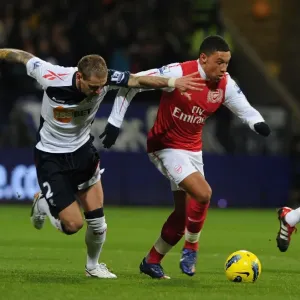 Arsenal's Alex Oxlade-Chamberlain Outmaneuvers Bolton's Gretar Steinsson Arsenal's Alex Oxlade-Chamberlain Outmaneuvers Bolton's Gretar Steinsson