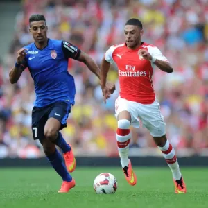 Arsenal's Alex Oxlade-Chamberlain Outmaneuvers AS Monaco's Nabil Dirar