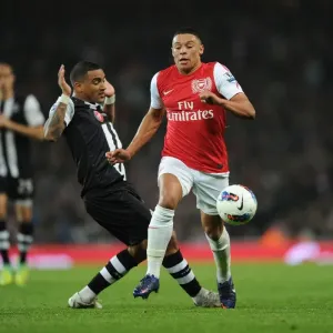 Arsenal's Alex Oxlade-Chamberlain Surges Past Newcastle's Danny Simpson in 2011-12 Premier League Clash Arsenal's Alex Oxlade-Chamberlain Surges Past Newcastle's Danny Simpson in 2011-12 Premier League Clash