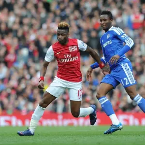 Arsenal's Alex Song Outmaneuvers Chelsea's John Obi Mikel Arsenal's Alex Song Outmaneuvers Chelsea's John Obi Mikel
