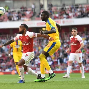 Arsenal's Alexandre Lacazette Faces Off Against Cheikhou Kouyate in Intense Arsenal v Crystal Palace Clash