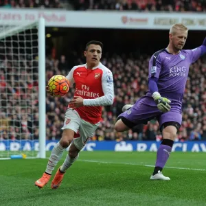 Arsenal's Alexis Sanchez Battles Kasper Schmeichel for Possession in Intense Arsenal vs Leicester City Clash Arsenal's Alexis Sanchez Battles Kasper Schmeichel for Possession in Intense Arsenal vs Leicester City Clash