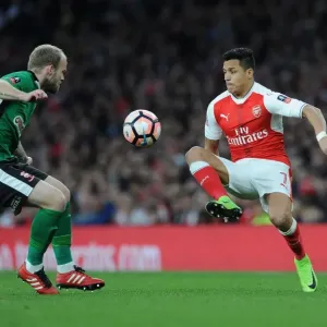 Arsenal's Alexis Sanchez Clashes with Lincoln City's Bradley Wood in FA Cup Quarter-Final Arsenal's Alexis Sanchez Clashes with Lincoln City's Bradley Wood in FA Cup Quarter-Final