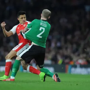 Print of Alexis Sanchez in action against Bradley Wood