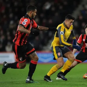 Arsenal's Alexis Sanchez Faces Off Against Bournemouth's Harry Arter and Joshua King in Premier League Clash