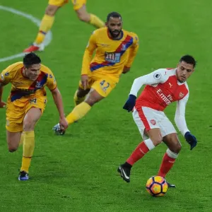 Arsenal's Alexis Sanchez Faces Off Against Crystal Palace's Martin Kelly and Jason Puncheon during the 2016-17 Premier League Match Arsenal's Alexis Sanchez Faces Off Against Crystal Palace's Martin Kelly and Jason Puncheon during the 2016-17 Premier League Match