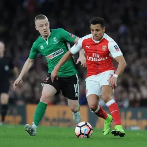 Arsenal's Alexis Sanchez Faces Off Against Lincoln's Terry Hawkridge in FA Cup Quarter-Final Showdown Arsenal's Alexis Sanchez Faces Off Against Lincoln's Terry Hawkridge in FA Cup Quarter-Final Showdown