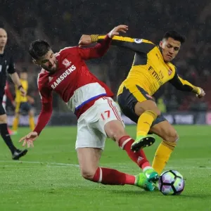 Arsenal's Alexis Sanchez Faces Off Against Middlesbrough's Antonio Barragan Arsenal's Alexis Sanchez Faces Off Against Middlesbrough's Antonio Barragan