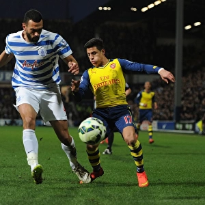 Arsenal's Alexis Sanchez Faces Off Against QPR's Steve Caulker in Premier League Clash
