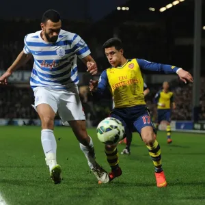 Arsenal's Alexis Sanchez Faces Off Against QPR's Steve Caulker in Premier League Clash