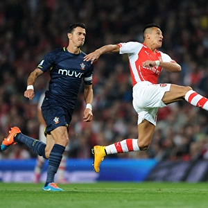 Arsenal's Alexis Sanchez Faces Off Against Southampton's Jose Fonte in League Cup Clash