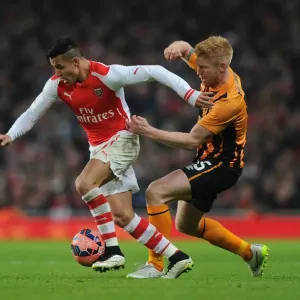 Arsenal's Alexis Sanchez Fends Off Hull City's Paul McShane in FA Cup Clash