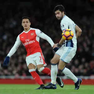 Arsenal's Alexis Sanchez Fends Off West Brom's Claudio Yacob