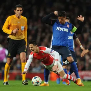 Arsenal's Alexis Sanchez Fouls by Monaco's Nabil Dirar in Champions League Clash