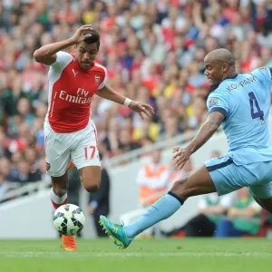 Arsenal's Alexis Sanchez Outmaneuvers Manchester City's Vincent Kompany Arsenal's Alexis Sanchez Outmaneuvers Manchester City's Vincent Kompany