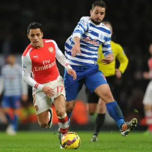 Arsenal's Alexis Sanchez Outmaneuvers QPR's Nico Kranjcar during the 2014-15 Premier League Match Arsenal's Alexis Sanchez Outmaneuvers QPR's Nico Kranjcar during the 2014-15 Premier League Match