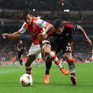Arsenal's Alexis Sanchez Tackles Besiktas Ramon Motta in Champions League Showdown