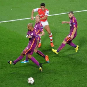 Arsenal's Alexis Sanchez Takes On Galatasaray's Defense in 2014 Champions League Clash Arsenal's Alexis Sanchez Takes On Galatasaray's Defense in 2014 Champions League Clash