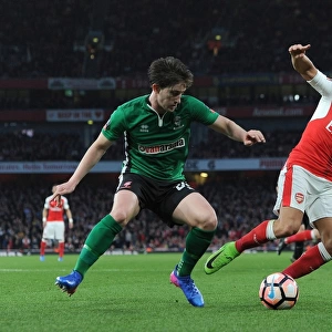Arsenal's Alexis Sanchez vs. Lincoln City's Alex Woodyard: A FA Cup Quarter-Final Battle