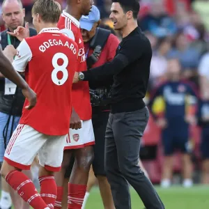 Arsenal's Arteta Celebrates with Magalhaes after Arsenal's Victory over Fulham (2022-23) Arsenal's Arteta Celebrates with Magalhaes after Arsenal's Victory over Fulham (2022-23)